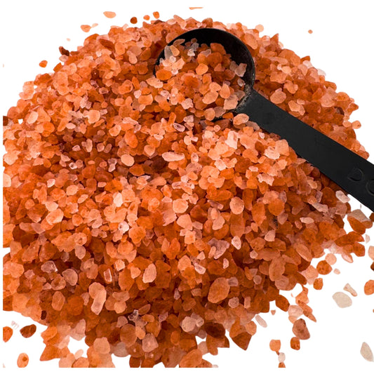 Coarse pink Himalayan salt crystals showing large grain texture ideal for grinders and finishing dishes