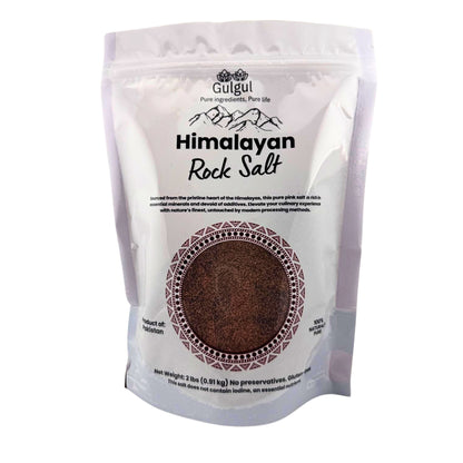 Black salt fine Himalayan kala namak in bowl showing pinkish-purple fine grain texture